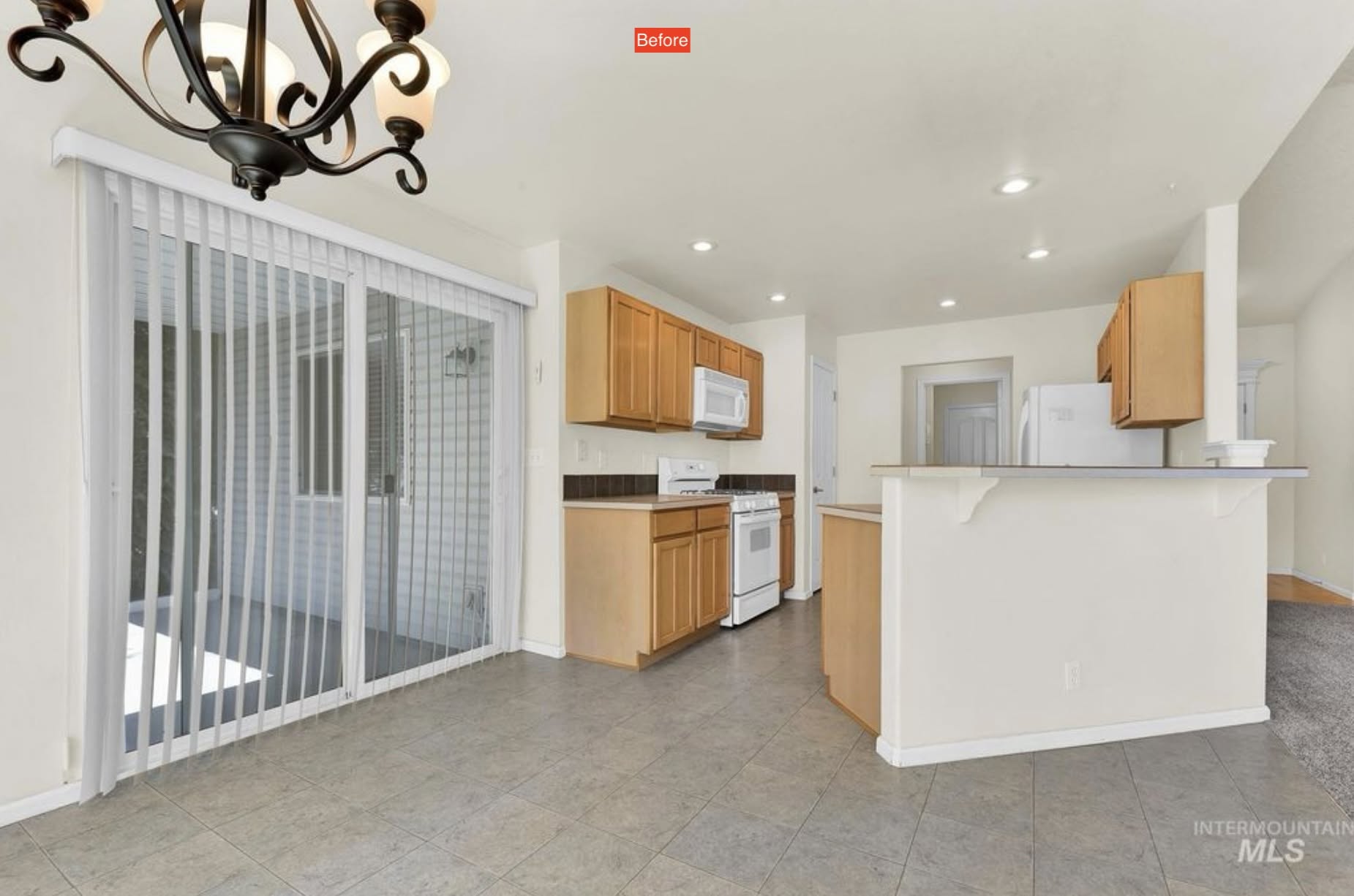 Original Meridian kitchen viewed from the dining area, showing oak cabinetry and raised peninsula